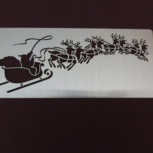 Pochoir * gaufrage * Noël * père Noël * traîneau * renne * LL556