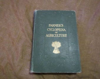 May include: A green hardcover book with gold lettering titled "Farmer's Cyclopedia of Agriculture".