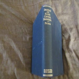 May include: A blue hardcover book titled "Drainage and Flood Control Engineering" by Pickels, published by McGraw-Hill Book Company.