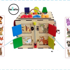 May include: Wooden activity cube with colorful doors and animal illustrations. The cube has a handle on top and features a variety of textures and activities for children. The cube is made of natural wood and is painted with non-toxic paints.