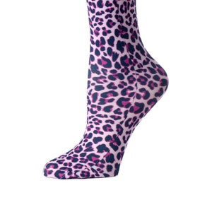 May include: Pink and black leopard print knee-high socks.