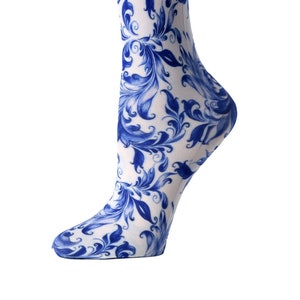 May include: White knee-high socks with a blue and white floral pattern.