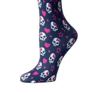 May include: A pair of blue knee-high socks with a pattern of white skulls, pink bows, and pink stars.