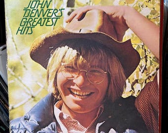 John Denver- John Denver's Greatest Hits. 33 rpm 12" country album, "Take Me Home Country Roads", "Rocky Mountain High", "Rhymes and Reasons