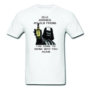 May include: A white t-shirt with a black and white image of Darth Vader holding a bottle of Jameson Irish Whiskey. The text "Hello Darkness My Old Friend" is above the image and the text "I've come to drink with you again" is below the image.