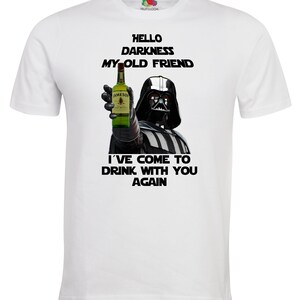 May include: White t-shirt with a black and white image of Darth Vader holding a bottle of Jameson Irish Whiskey. The text "Hello Darkness My Old Friend" and "I've Come To Drink With You Again" is printed on the shirt.