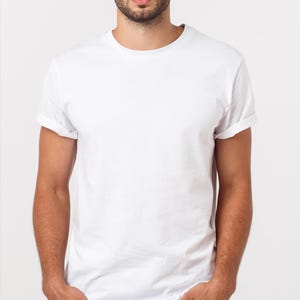 May include: A plain white t-shirt with short sleeves and a crew neck.
