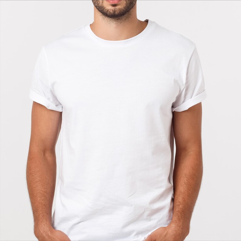 May include: A plain white t-shirt with short sleeves and a crew neck.