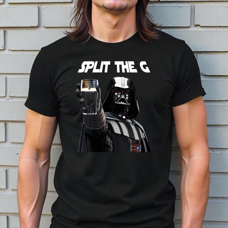 May include: Black t-shirt with a white graphic of Darth Vader holding a glass of Guinness beer. The text "SPLIT THE G" is above Darth Vader.
