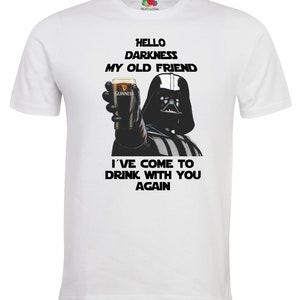 May include: White t-shirt with a black and white image of Darth Vader holding a glass of Guinness beer. The text "Hello Darkness My Old Friend" and "I've Come To Drink With You Again" is printed on the shirt.