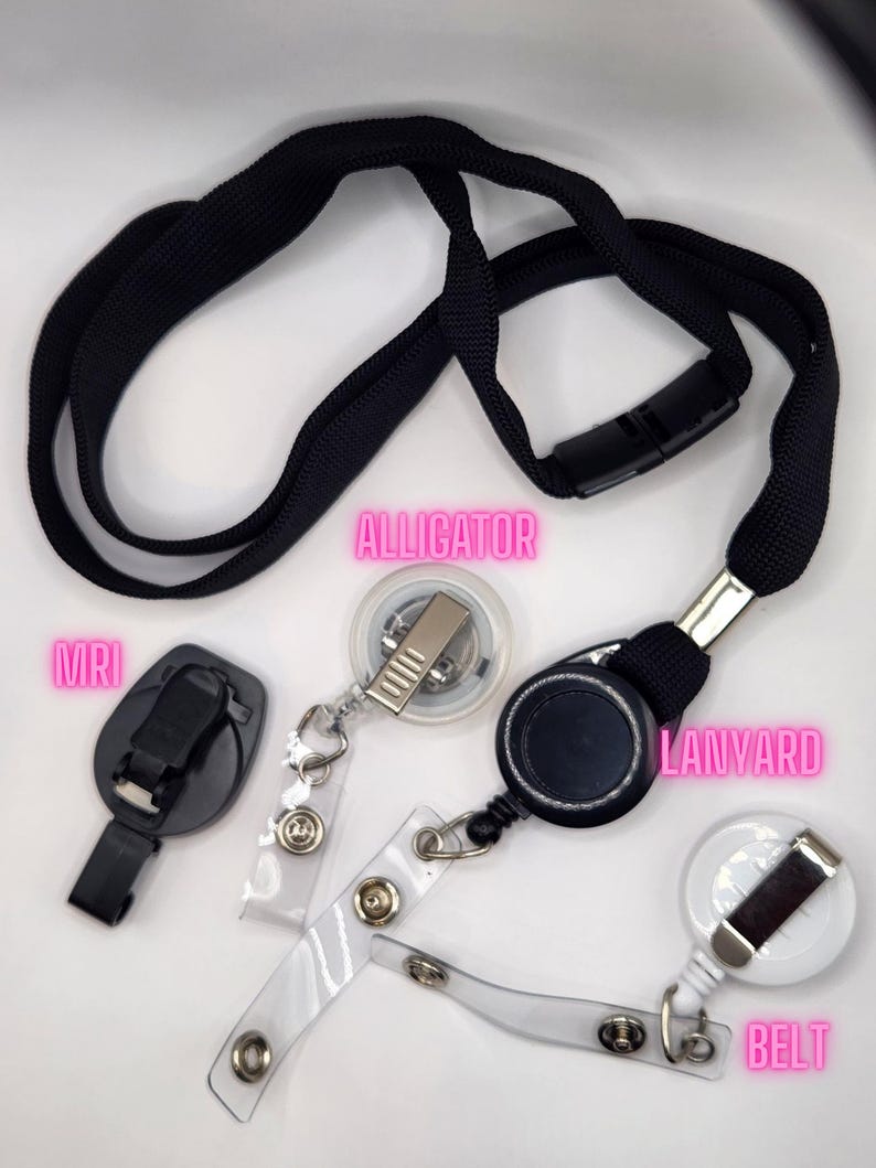 May include: A collection of black lanyards, badge reels, and accessories. Includes a black lanyard with a plastic clasp, a black badge reel, a clear plastic belt clip, and an MRI clip.