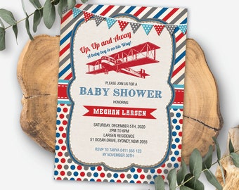 May include: A red, white, and blue baby shower invitation with a vintage airplane illustration. The invitation reads "Up, Up and Away! A baby boy is on his way!" and includes the text "Please join us for a Baby Shower honoring Meghan Larsen".