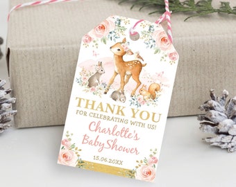 May include: A printable baby shower favor tag with a pink and gold floral design. The tag features a deer, a rabbit, and a squirrel. The text on the tag reads "Thank You for celebrating with us! Charlotte's Baby Shower 15.06.20XX".
