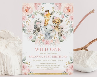 May include: A pink and gold invitation with a floral wreath and a group of safari animals. The text reads "Wild One" and "Savanna's 1st Birthday".