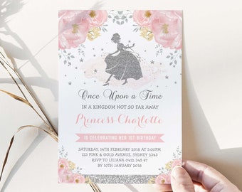 May include: A princess-themed invitation with a silver glitter silhouette of a princess. The invitation features pink and yellow floral accents, the text "Once Upon a Time," and details for a first birthday celebration.