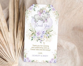 May include: Purple and gold thank you tag with a watercolor illustration of a sleeping elephant with a floral crown. The text reads "Thank You" and "Thank you for coming and celebrating with us. Please take one and enjoy! Love, Scarlett & Rhett."