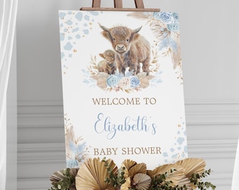 May include: Welcome to Elizabeth's Baby Shower sign with a watercolor illustration of a Highland cow and calf with blue and gold floral accents.