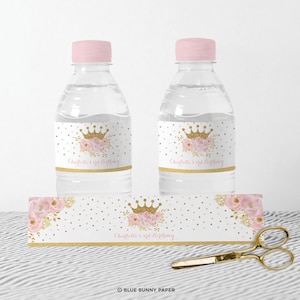 May include: Water bottle labels with a pink and gold floral design and a crown. The labels say "Charlotte's 3rd Birthday".