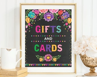 May include: A printable sign with a black chalkboard background and colorful floral border. The text "GIFTS AND CARDS" is written in colorful letters.