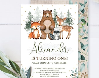 May include: A woodland-themed first birthday party invitation with a watercolor illustration of a bear, fox, raccoon, and deer. The invitation is decorated with gold glitter and green leaves. The text on the invitation reads "Alexander is turning one! Please join us to celebrate!"  Saturday, 10th January 2018 at 4pm. The Stevens Residence. 123 Botanical Avenue, Sydney NSW 2345. RSVP Elisa 0412 345 678 by 30th December 2017.