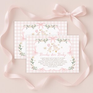 May include: Two baby shower invitations with a pink gingham pattern and floral accents. The cards feature illustrations of ducks with balloons and the text "Books for Baby". A pink ribbon with a bow is draped across the image.