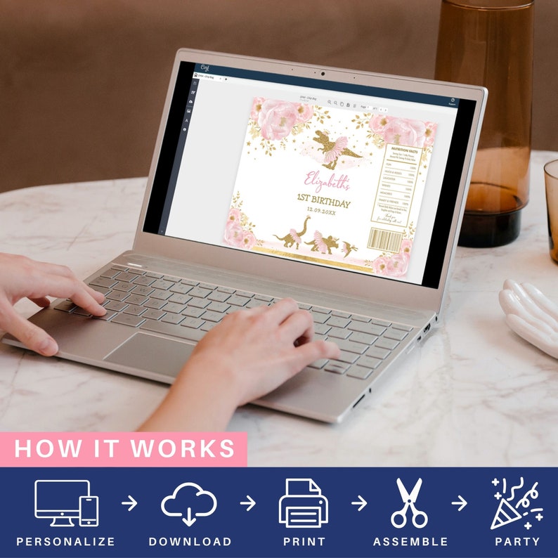 May include: A laptop computer screen displaying a pink and gold dinosaur-themed printable party favor label. The label features a pink dinosaur wearing a tutu and the text "Elizabeth's 1st Birthday 12.03.2023". The image shows a step-by-step guide on how to personalize, download, print, assemble, and party with the labels.
