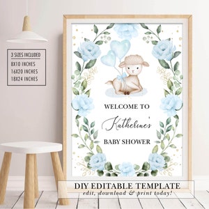 May include: A printable baby shower sign with a blue and green floral wreath, a cute lamb holding blue balloons, and the text "Welcome to Katherine's Baby Shower".