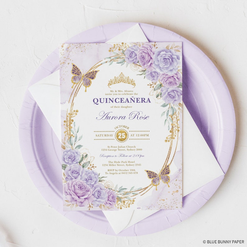 May include: Purple and gold quincea&ntilde;era invitation with a floral design and butterflies. The invitation includes the date, time, and location of the event. The text reads "Mr. & Mrs. Alvarez invite you to celebrate the Quincea&ntilde;era of their daughter Aurora Rose. October 25th at 12:00 PM. St. Peter Julian Church, 1234 George Street, Sydney 7000. Reception to follow at 2:00 PM. The Hyde Park Hotel, 1234 Miller Street, Sydney 2545. RSVP by October 10th to Angela at 0412 345 678."