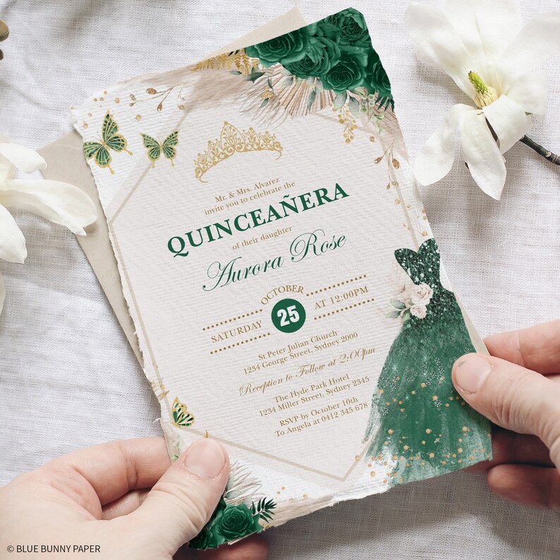 May include: A Quincea&ntilde;era invitation with a gold and green color scheme. The invitation features a crown, butterflies, and a green dress with gold accents. The text on the invitation reads "Quincea&ntilde;era" and "Aurora Rose". The date of the event is October 25th.