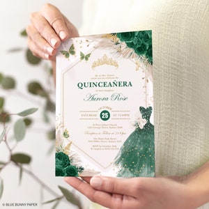 May include: A Quincea&ntilde;era invitation with a gold crown, green and white flowers, and a green dress with gold glitter. The text reads "Mr. & Mrs. Alvare invite you to celebrate the Quincea&ntilde;era of their daughter Aurora Rose. Saturday, October 25th at 12:00 PM. St. Peter Julian Church, 1234 George Street, Sydney 2000. Reception to follow at 2:00 PM. The Hyde Park Hotel, 1254 Miller Street, Sydney 2145. RSVP by October 10th to Angela at 0412 345 678."