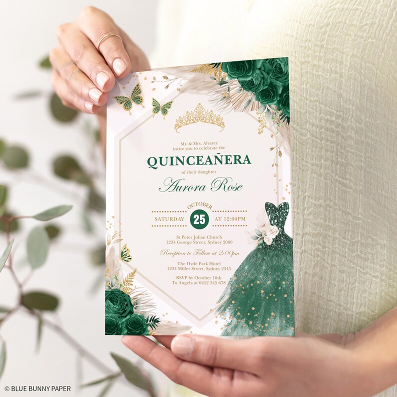 May include: A Quincea&ntilde;era invitation with a gold crown, green and white flowers, and a green dress with gold glitter. The text reads "Mr. & Mrs. Alvare invite you to celebrate the Quincea&ntilde;era of their daughter Aurora Rose. Saturday, October 25th at 12:00 PM. St. Peter Julian Church, 1234 George Street, Sydney 2000. Reception to follow at 2:00 PM. The Hyde Park Hotel, 1254 Miller Street, Sydney 2145. RSVP by October 10th to Angela at 0412 345 678."