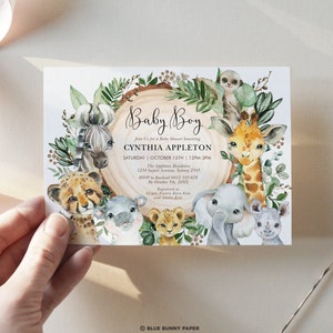 May include: A baby shower invitation with a jungle theme. The invitation features a circle of animals including a zebra, cheetah, giraffe, elephant, hippopotamus, lion, and monkey. The text on the invitation reads "Baby Boy" and includes the name of the guest of honor, Cynthia Appleton, the date and time of the shower, and the location. The invitation also includes information about RSVP and gift registry.