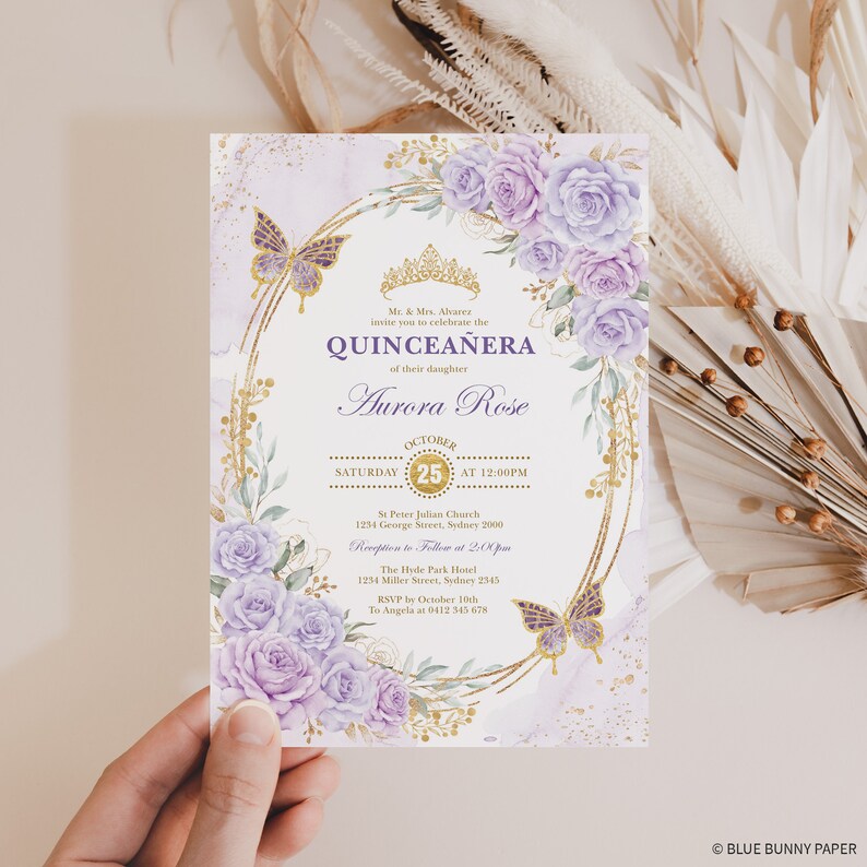 May include: Purple and gold quincea&ntilde;era invitation with a floral design and butterflies. The invitation includes the date, time, and location of the event. RSVP information is also included.