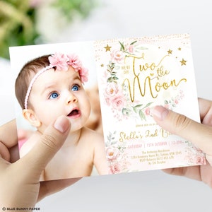 May include: A pink and gold birthday invitation with a photo of a baby girl. The invitation says "Two the Moon" and includes details for Stella's 2nd birthday party.