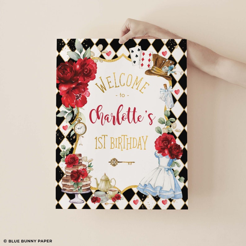 May include: A white welcome sign with black and white checkered background. The sign says "Welcome to Charlotte's 1st Birthday". The sign is decorated with red roses, a teacup, a teapot, a cake, a key, and Alice in Wonderland characters.