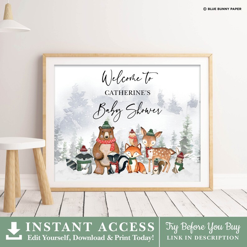 May include: A printable welcome sign for a baby shower with a winter woodland theme. The sign features a watercolor background with a snowy forest scene and a group of animals wearing winter hats and scarves. The text on the sign reads "Welcome to Catherine's Baby Shower".