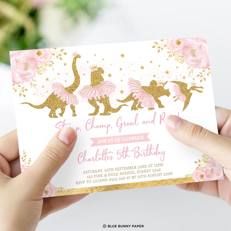 May include: A white invitation card featuring gold glitter dinosaur illustrations with pink tutus and crowns. The text says "Stomp, Chomp, Growl and Roar" and "Join us to celebrate Charlotte's 5th Birthday".