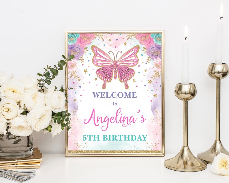 May include: A welcome sign for a 5th birthday party with a pink butterfly, gold glitter, and floral accents. The sign says "Welcome to Angelina's 5th Birthday".