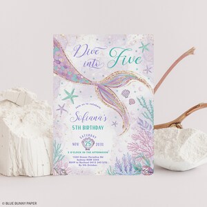 May include: A mermaid-themed birthday invitation with the text "Dive into Five." The invitation features a mermaid tail, starfish, and coral in shades of purple, teal, and gold. The invitation is for Sofiana's 5th birthday on November 25, 2031.