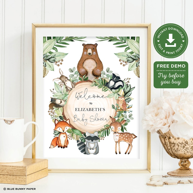 May include: A printable welcome sign for a baby shower with a woodland theme. The sign features a brown bear, a fox, a deer, a raccoon, and an owl surrounded by greenery. The text on the sign reads "Welcome to Elizabeth's Baby Shower".