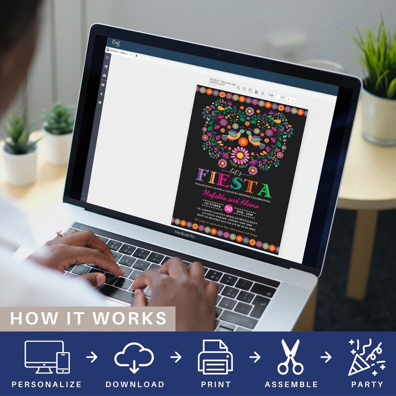 May include: A laptop screen displaying a printable invitation for a fiesta themed party. The invitation features a black background with colorful flowers, birds, and the text "Let's Fiesta". The text "Please join us for a couple shower celebrating Mafalda and Alvaro" is also included. The invitation is being edited on a computer screen.
