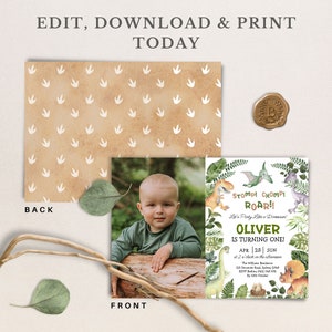 May include: A dinosaur-themed first birthday party invitation featuring a photo of a baby boy. The invitation has a green, brown, and white watercolour design with dinosaurs, leaves, and eggs. The text on the invitation reads "Stomp! Chomp! Roar!! Let's Party Like a Dinosaur! Oliver is Turning One! Apr 25 | Sun at 2 o'clock in the afternoon. The Wine Room, 123 Dinosaur Road, Selby 2045. RSVP Bettina 0412 045 678 By 10th October."