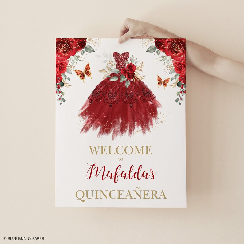 May include: Welcome to Mafalda's Quincea&ntilde;era sign with a red and gold watercolor illustration of a dress with butterflies and flowers.