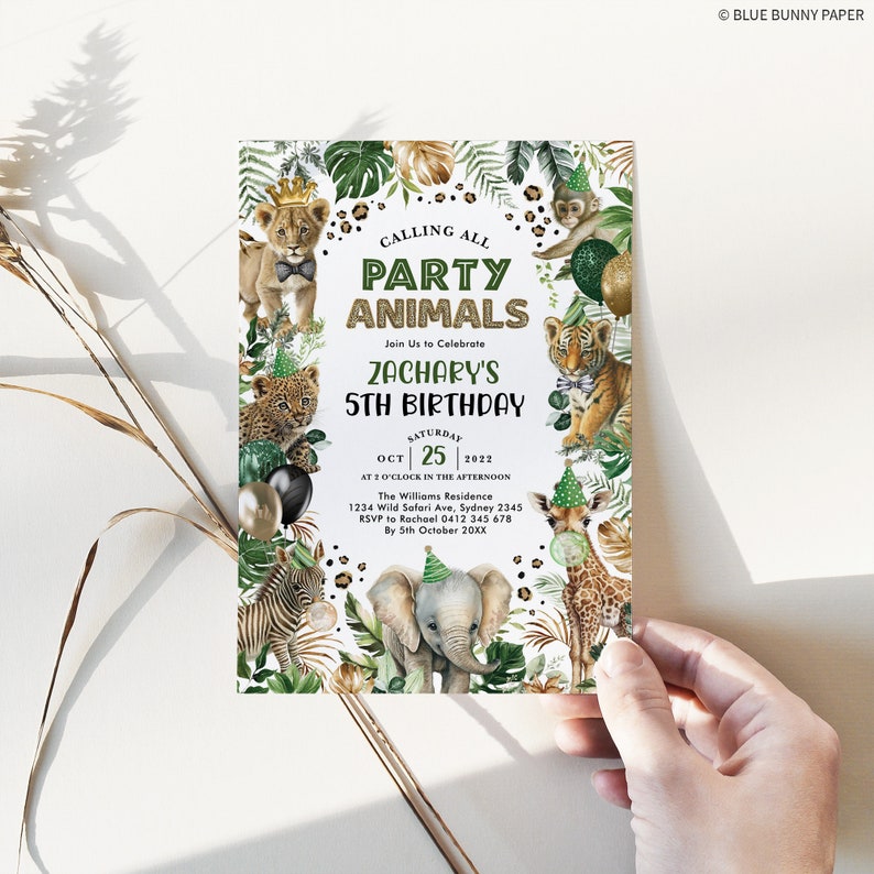 May include: A green and gold jungle-themed party invitation for Zachary's 5th birthday. The invitation features a variety of animals, including a lion, tiger, giraffe, zebra, and elephant. The text on the invitation reads "Calling All Party Animals" and "Zachary's 5th Birthday".