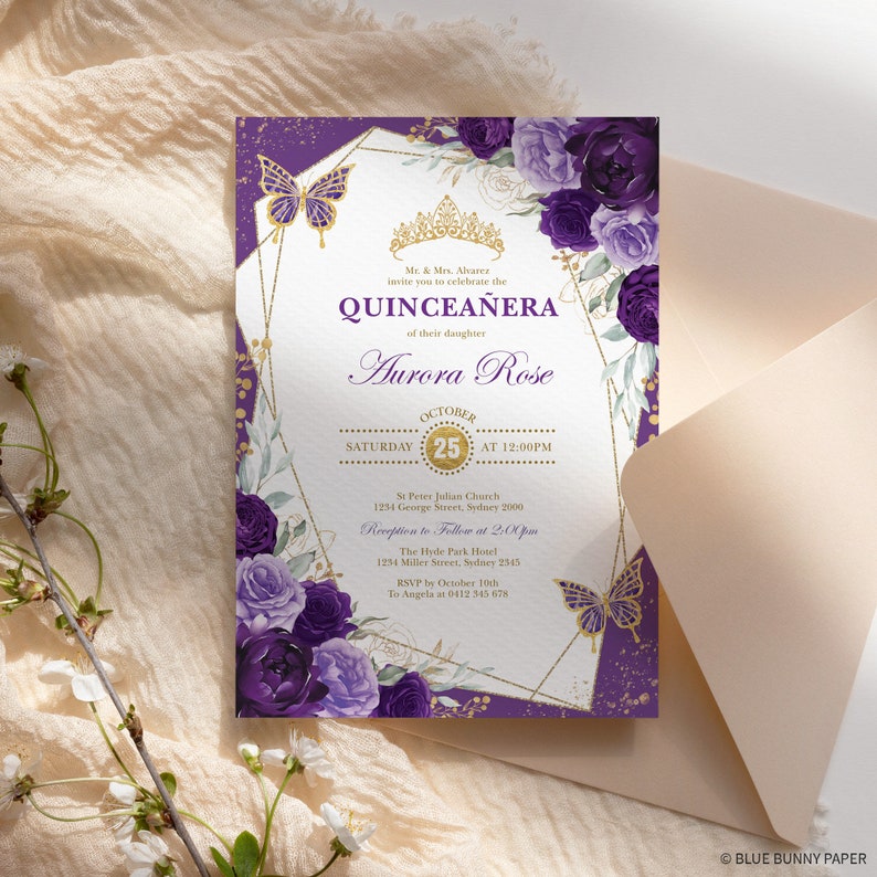 May include: A quincea&ntilde;era invitation with a floral and butterfly design. The invitation features the text "QUINCEA&Ntilde;ERA" and "Aurora Rose" in elegant script. The design includes purple flowers, gold accents, and a geometric frame.