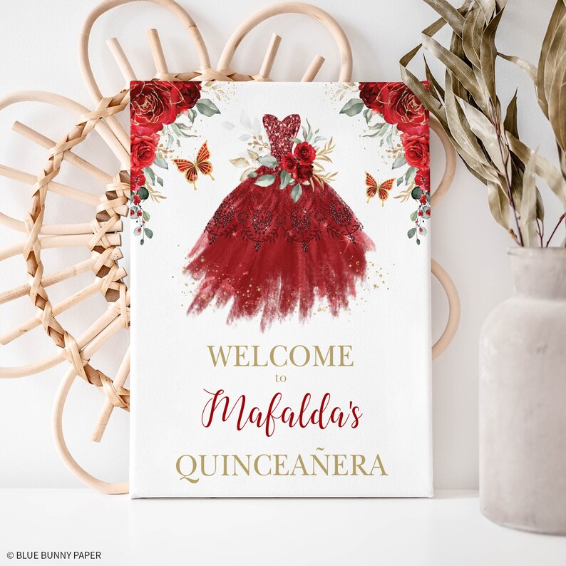 May include: Welcome to Mafalda's Quincea&ntilde;era sign with a red watercolor dress, gold glitter, and red roses with butterflies.