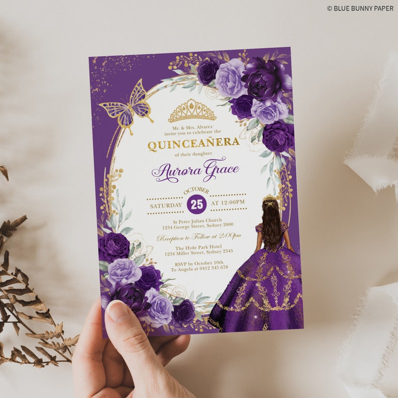 May include: Purple and gold Quincea&ntilde;era invitation with a floral design and a silhouette of a girl in a purple dress. The invitation includes the text "Quincea&ntilde;era" and "Aurora Grace".