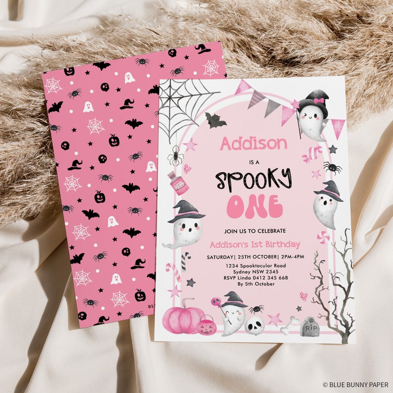 May include: Pink and black Halloween party invitation with a ghost wearing a witch hat and holding a candy cane. The invitation says "Addison is a Spooky One" and includes details for the party, including the date, time, and location.