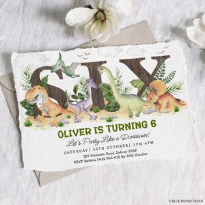 May include: A dinosaur-themed birthday party invitation for a boy turning six. The invitation features a colorful illustration of dinosaurs and the number six, with the text "Oliver is turning 6" and "Let's Party Like a Dinosaur!" The invitation also includes the date, time, and location of the party, as well as RSVP information.