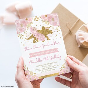 May include: A pink and gold birthday invitation with a gold glitter dinosaur wearing a pink tutu. The invitation says "Stomp. Chomp. Growl and Roar!" and "Charlotte's 5th Birthday".